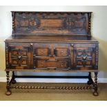 1930's period Jacobean revival oak sideboard, 139cm x 151cm x 53cm approx Condition: The panels to