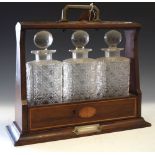 Edwardian string inlaid tantalus with three cut glass decanters Condition: Tantalus is locked and no