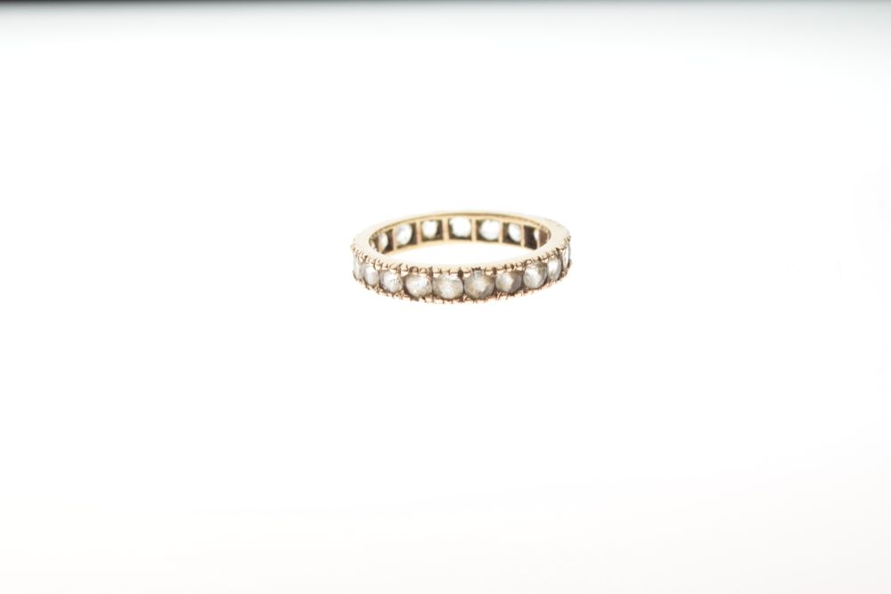 Unmarked yellow metal eternity ring set white stones, size M, 2.2g gross approx Condition: Light - Image 2 of 4