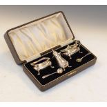 George V silver three piece condiment set with blue glass liners, Birmingham 1932, 129g approx, in