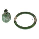 Small jade scent bottle, together with jade bangle with plated mounts Condition: Some cracks/chips