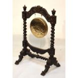 Late Victorian carved oak dinner gong, 111cm high Condition: Gong appears too small for the frame
