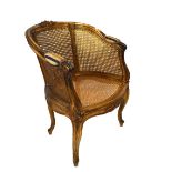 19th Century gilt and cane occasional chair with padded arms, 83cm high Condition: Some repair to