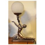 Reproduction Art Deco style table lamp in the form of a female holding a glass globe, 47cm high