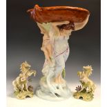 Large mid 20th Century Royal Dux figural centre piece with cherub supported on an oval bowl, 51cm