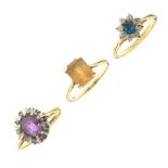 Three assorted dress rings, the first 18ct gold set central amethyst-coloured stone within border of