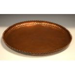 20th Century Eastern copper tray with shaped edge, 55cm diameter Condition: **General condition