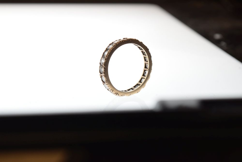 Unmarked yellow metal eternity ring set white stones, size M, 2.2g gross approx Condition: Light - Image 4 of 4