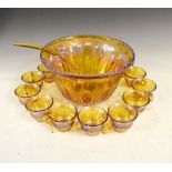 Early 20th Century moulded amber glass punch bowl and cups, each with moulded grapevine