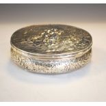 Continental silver oval box having repoussé figural decoration of a girl and a boy with their dog,