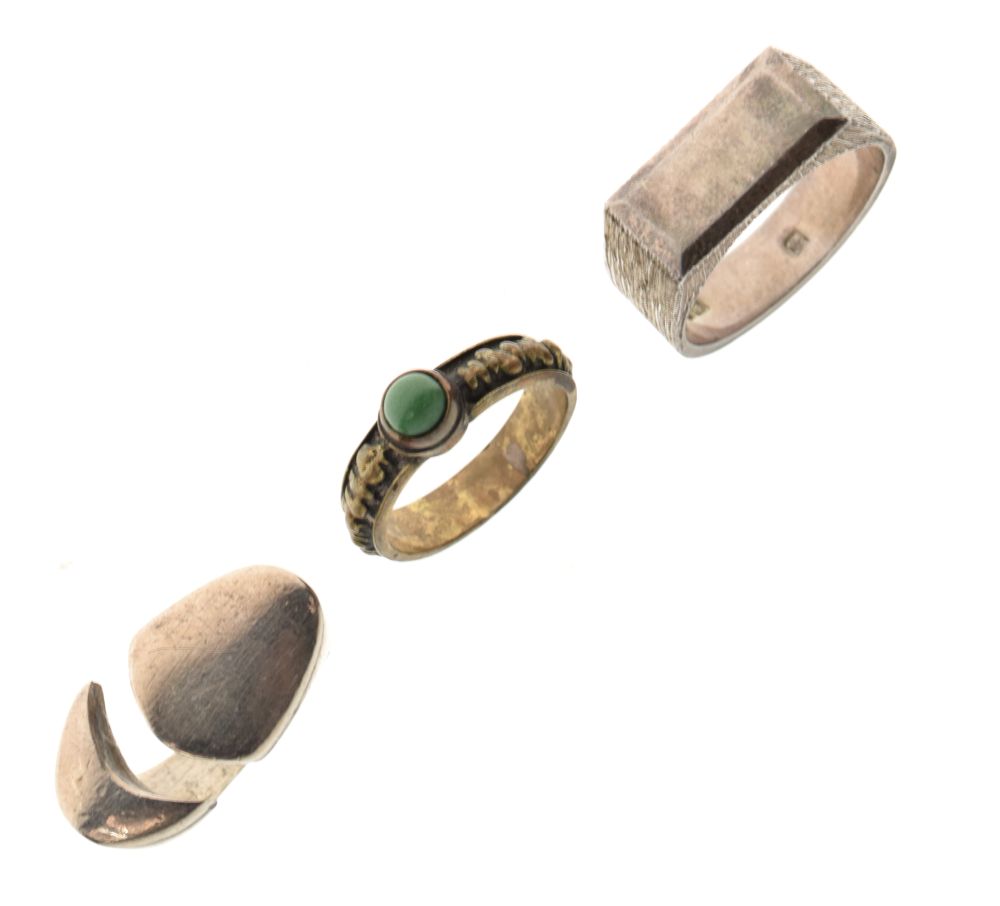 Three assorted dress rings comprising a hallmarked silver signet-style example, size W, an