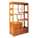 Chinese hardwood shelving unit having asymmetrical shelves above two door cupboard and drawer,