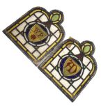 Two late 19th Century stained glass panels having yellow glass border, the central roundel having