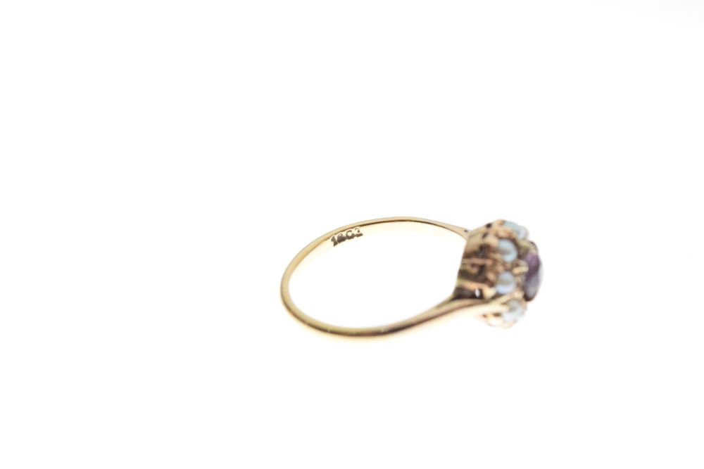 Yellow metal dress ring set amethyst-coloured stone within seed pearls, shank stamped 18ct, size - Image 5 of 5