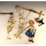 Two vintage boxed Pelham skeleton puppets, together with a puppet of a female with cat Condition: