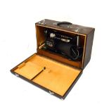 Cased Singer electric sewing machine Condition: PAT tested only, sold as seen, and not in working