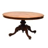 Victorian mahogany oval top loo/breakfast table standing on four carved feet, 142cm x 110cm x 75cm