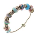 Pandora - flexible bracelet set with fifteen assorted glass and metal charms Condition: Only the
