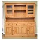 Waxed pine dresser, 177cm x 48cm x 198cm high Condition: Some water stains to top of lower stage,