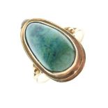 Yellow metal and malachite dress ring with ovoid cabochon, shank stamped 14k, size N, 3.7g gross