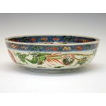19th Century Japanese porcelain bowl, decorated in iron red, blue and green enamel with a crane or