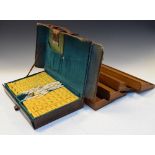 Vintage mah-jong set in tan leather case, with four wooden stands, together with 'Ultimate Mah-