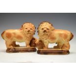 Pair of Staffordshire pottery figures of lions, 28cm high Condition: Lacking glass eyes. One lion