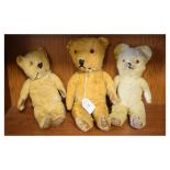 Three 20th Century golden mohair teddy bears Condition: Loss of mohair to all of the bears, one bear