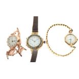 Three lady's wristwatches comprising: yellow metal example, white Arabic dial with red numeral 12