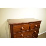 Victorian mahogany chest of two short and three long drawers with turned wooden handles, 110cm