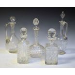 Five cut glass decanters and claret jugs, tallest 34cm high Condition: Clouding/dirt to the