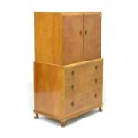 Mid 20th Century Art Deco-style tall boy, the upper section having two hinged doors, the lower