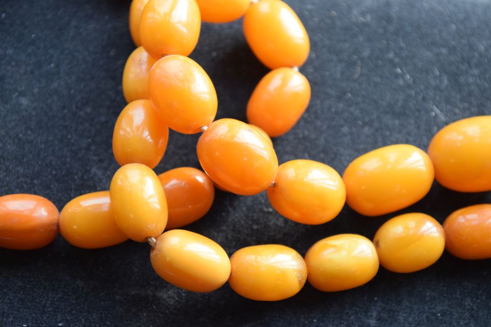 Graduated string of amber beads, 84cm long approx, 52g approx Condition: **Due to current lockdown - Image 6 of 8