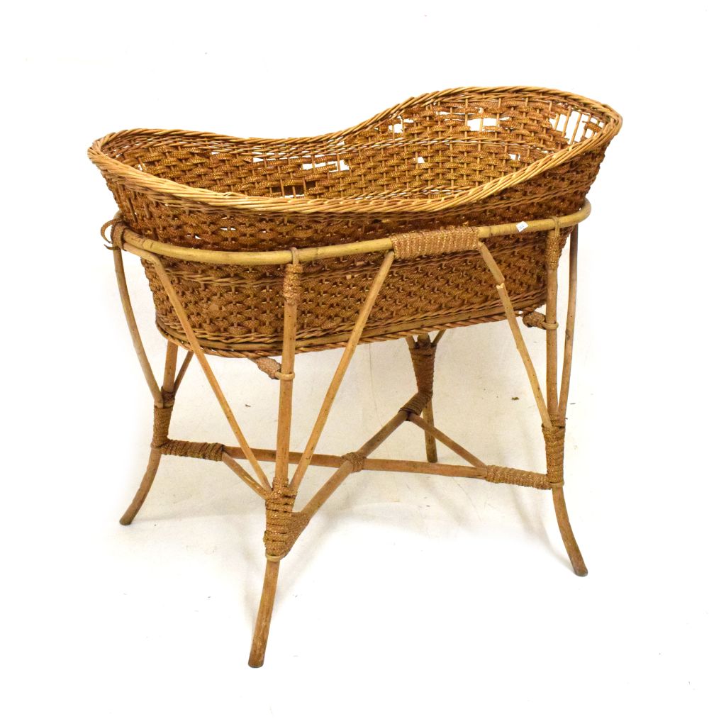 Bamboo and wicker cradle or bassinet, 88cm long x 78cm high Condition: Woodworm to the frame and