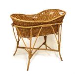Bamboo and wicker cradle or bassinet, 88cm long x 78cm high Condition: Woodworm to the frame and
