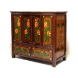 Tibetan design polychrome decorated wedding cabinet fitted two sliding doors with two drawers below,