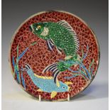 Majolica pottery plate decorated with two fish, indistinct impressed marks to base, 22cm diameter