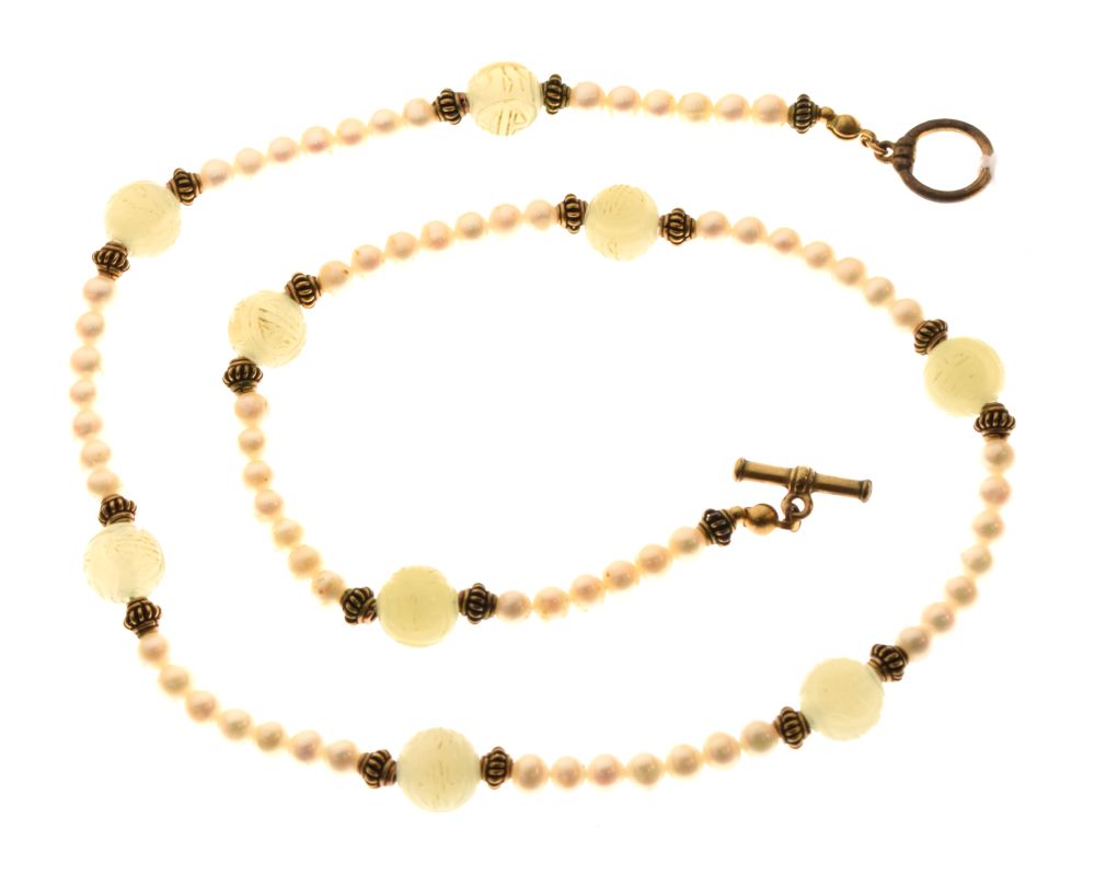 Cultured pearl and carved celadon jade necklace with nine carved jade ball spacers, 51.5cm long