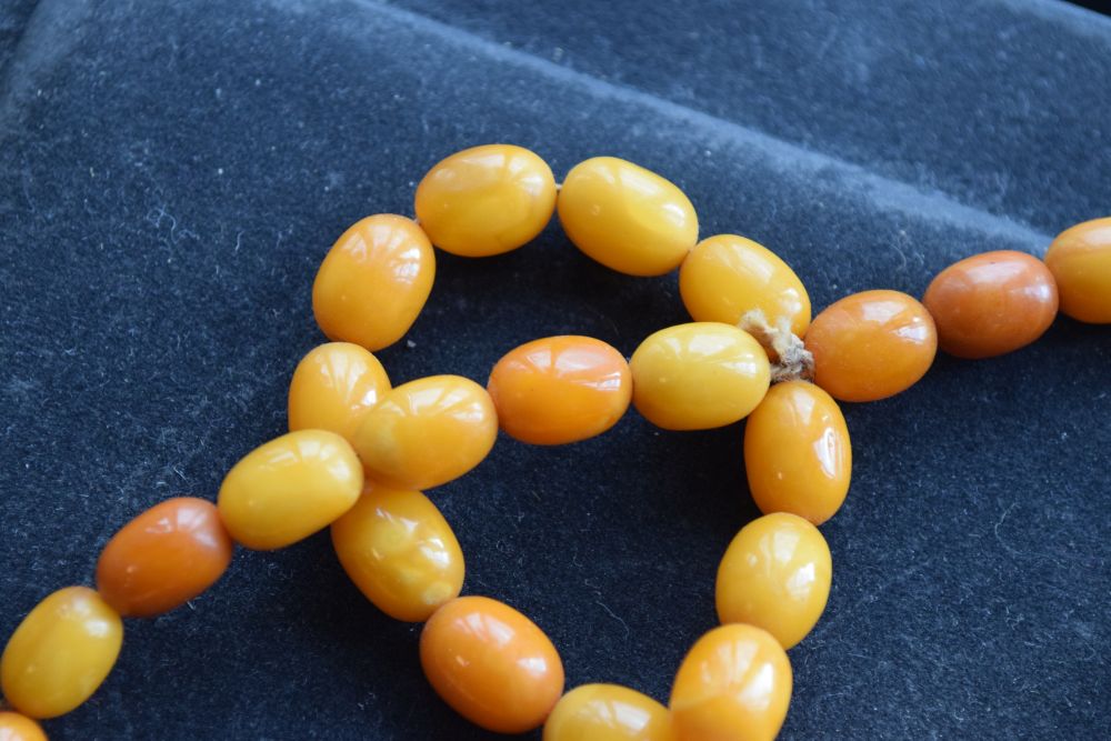 Graduated string of amber beads, 84cm long approx, 52g approx Condition: **Due to current lockdown - Image 2 of 8