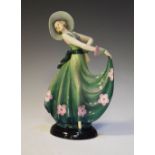 Art Deco pottery figure of a lady in a green dress, 28cm high Condition: We endeavour to mention any