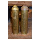 Two brass shell cases and caps, 31.5cm high Condition: The caps do not fit well and are only resting