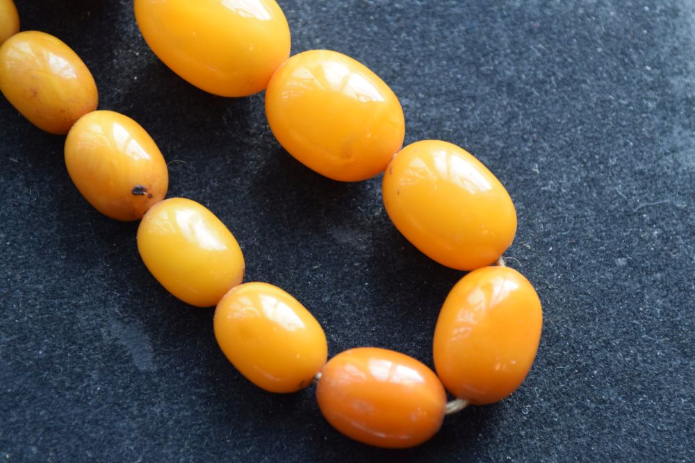 Graduated string of amber beads, 84cm long approx, 52g approx Condition: **Due to current lockdown - Image 8 of 8