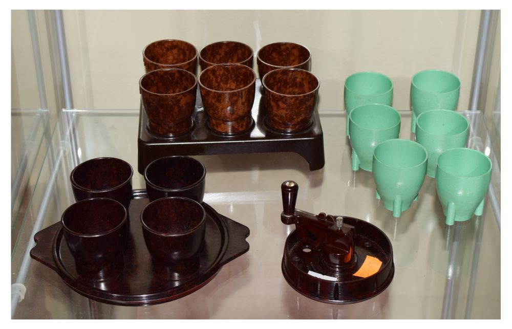 Three sets of Bakelite egg cups, together with a patent Patons & Baldwins 'patwin' rug wool cutter