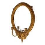 Early 20th Century gilt gesso framed girandole or wall mirror, 56cm x 37cm Condition: Cracks and