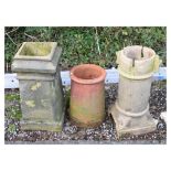 Three various chimney pots, the largest measuring 65cm high Condition: The large circular pot has