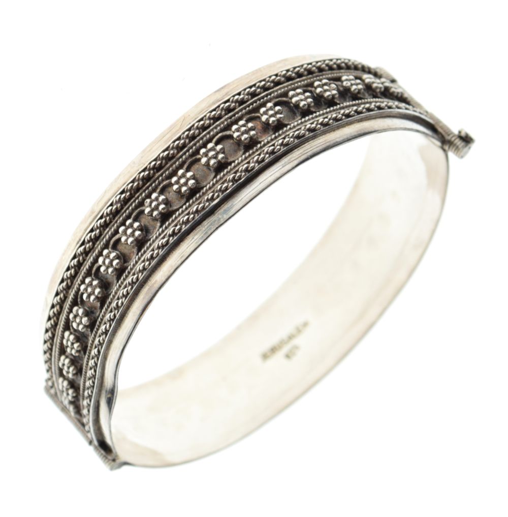Judaica - Israeli white metal snap bangle stamped Jerusalem 925, the exterior with berry cluster and