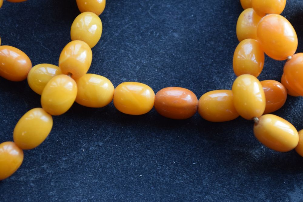 Graduated string of amber beads, 84cm long approx, 52g approx Condition: **Due to current lockdown - Image 4 of 8