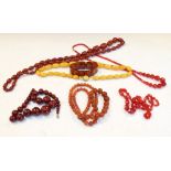 Selection of costume jewellery to include strings of amber-effect beads, faceted glass beads etc
