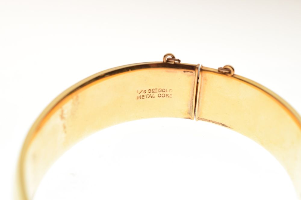 Yellow metal snap bangle, stamped 9ct metal core, 16mm wide, 30.7g gross approx Condition: ** Due to - Image 6 of 7