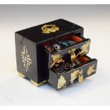 Oriental black lacquer jewellery chest containing a selection of white metal and enamel brooches,